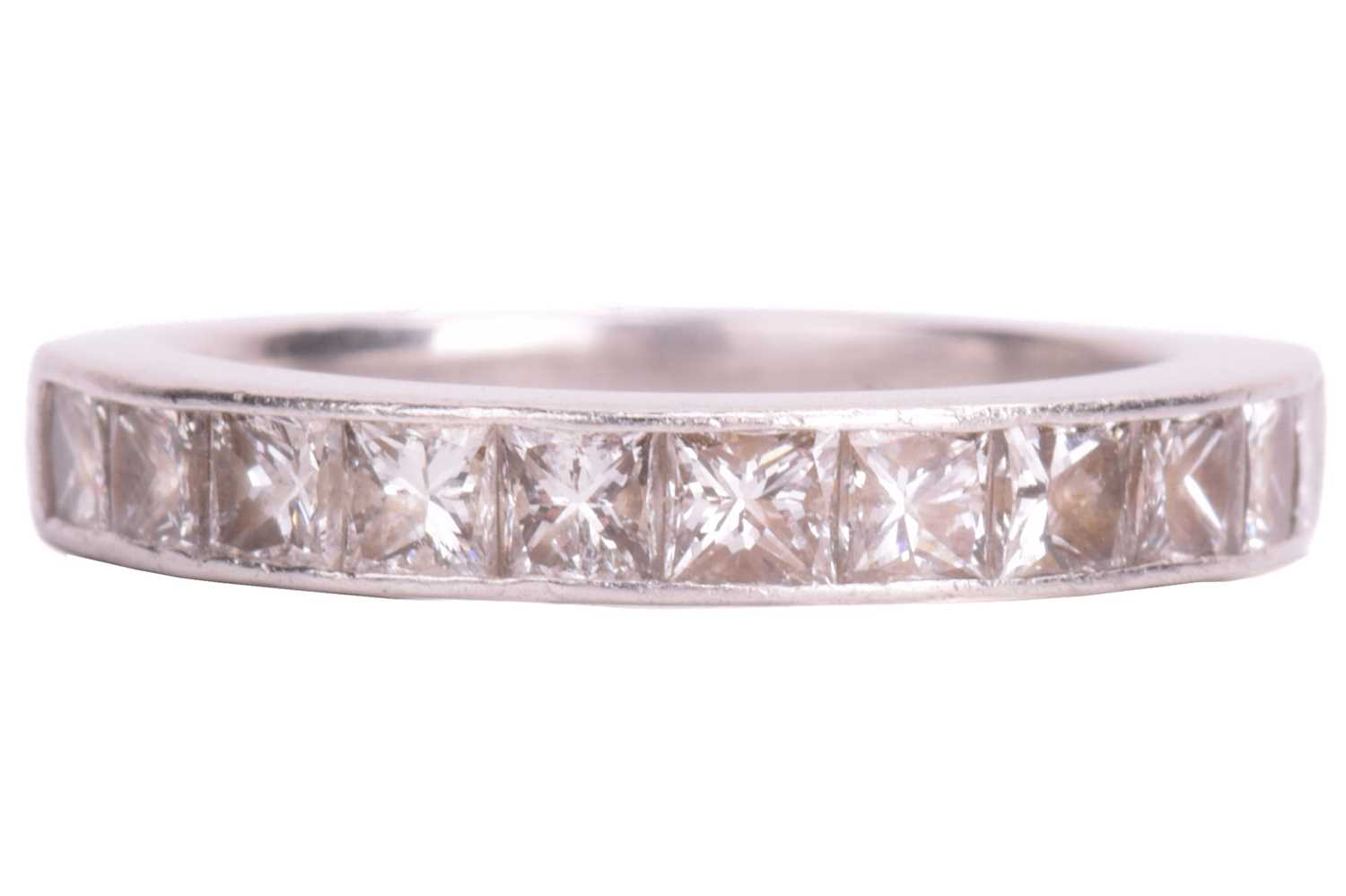 Lot 74 - A diamond half-eternity ring in platinum,...