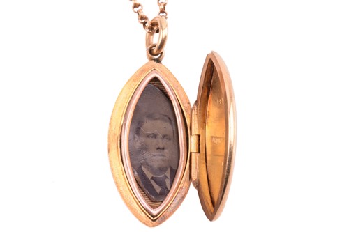 Lot 179 - A Victorian navette shape locket with engraved...