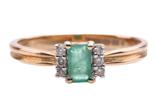 Lot 332 - An emerald and diamond ring in 9ct yellow gold,...