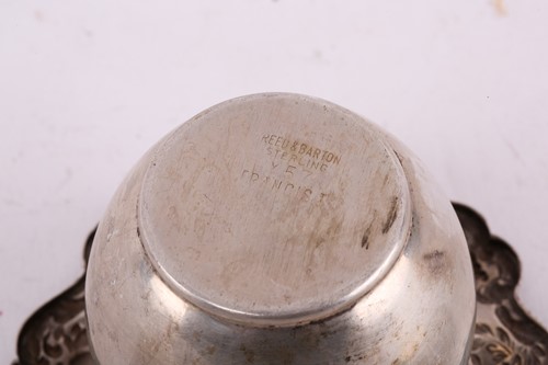 Lot 542 - A collection of white metal items stamped...