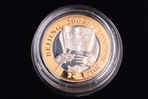 Lot 397 - Four coins including an Elizabeth II 2010 gold...