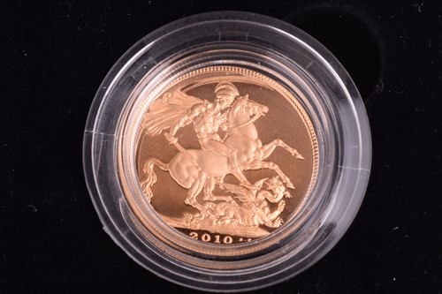 Lot 397 - Four coins including an Elizabeth II 2010 gold...
