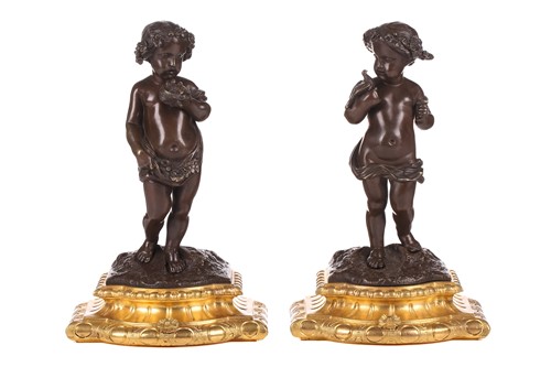Lot 244 - A pair of bronze figures of standing putti...