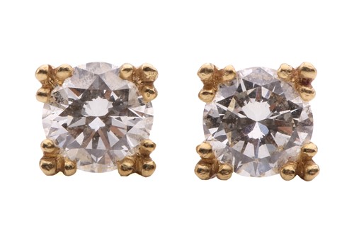 Lot 260 - A pair of diamond stud earrings, each set with...