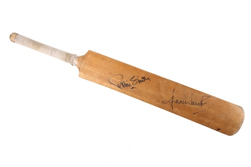 Lot 308 - A cricket bat signed in pen by Hampshire and...