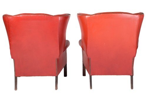 Lot 172 - A pair of red leather button back wing...