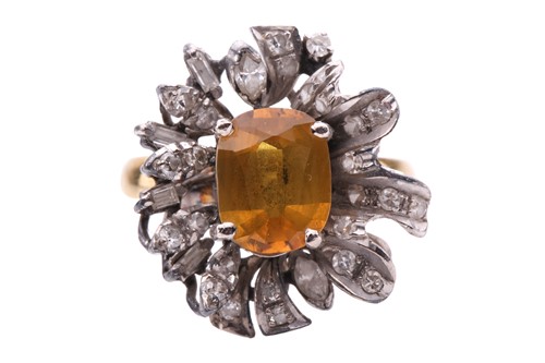 Lot 110 - A yellow sapphire and diamond cluster ring,...