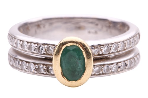 Lot 114 - An emerald and diamond ring, set to the centre...