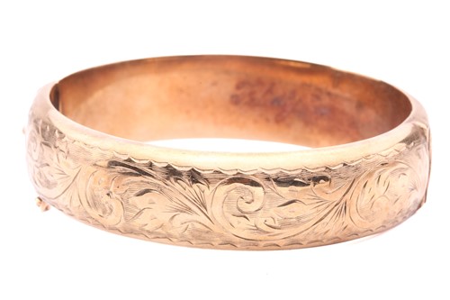 Lot 119 - A 9ct yellow gold hinged bangle, half of the...