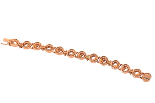 Lot 116 - An emerald and diamond circular link bracelet...