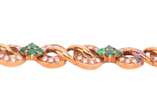 Lot 116 - An emerald and diamond circular link bracelet...