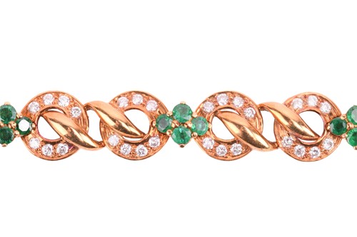 Lot 116 - An emerald and diamond circular link bracelet...