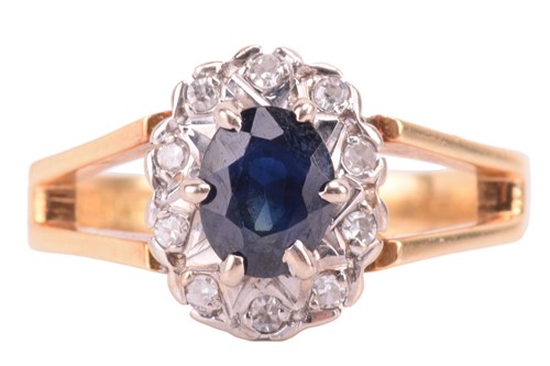 Lot 140 - A sapphire and diamond oval cluster ring set...