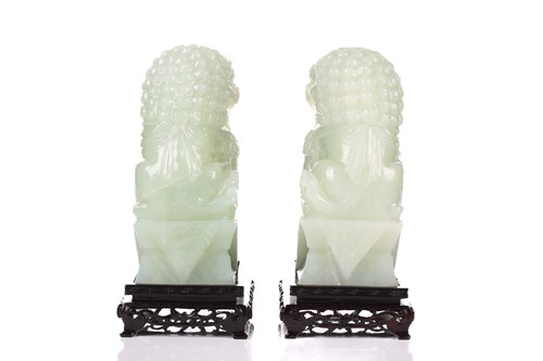 Lot 118 - A pair of Chinese bowenite carved dogs of foo,...