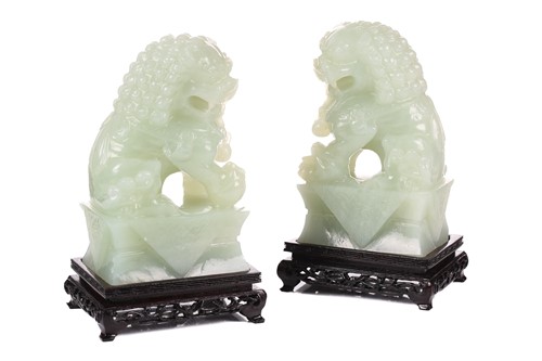 Lot 118 - A pair of Chinese bowenite carved dogs of foo,...