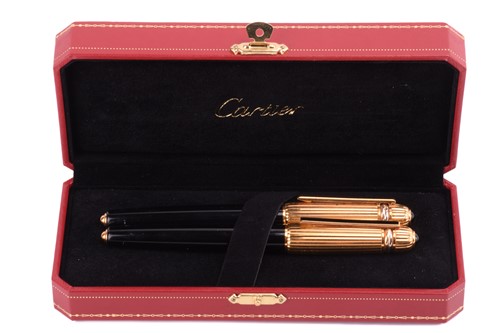 Lot 405 - Pasha de Cartier - a ballpoint pen and a...