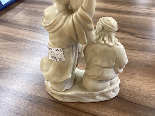 Lot 135 - A Chinese Blanc de Chine porcelain figure of...