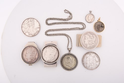 Lot 385 - A collection of coins and money clips...