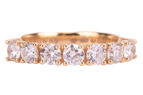 Lot 207 - A diamond half eternity ring, claw-set with...