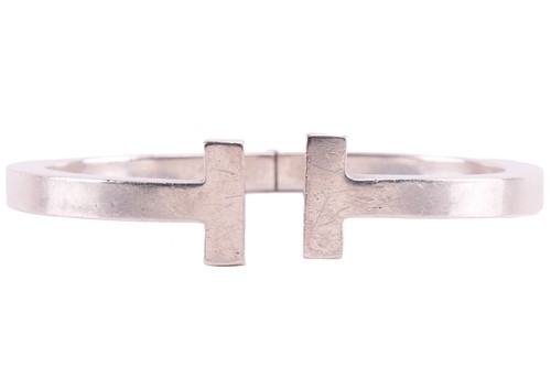 Lot 99 - A silver 'Tiffany T' square hinged bracelet by...
