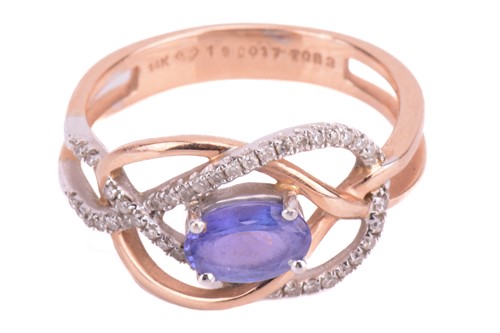 Lot 26 - A tanzanite and diamond dress ring in a knot...