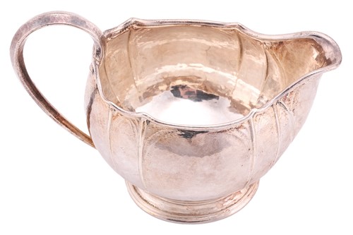 Lot 571 - Omar Ramsden:- An Arts and Crafts silver milk...