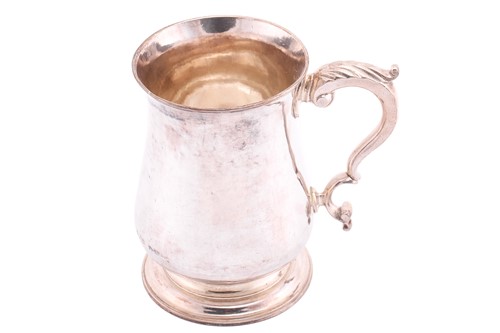 Lot A George III silver tankard; plain low-bellied...