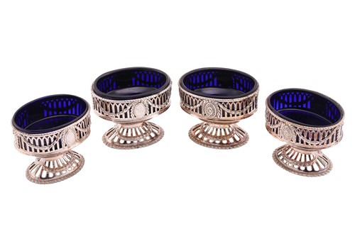 Lot 554 - A set of four George III silver salts by...