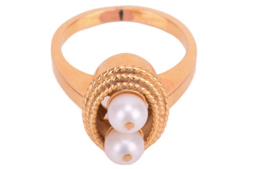 Lot 120 - A pearl-set dress ring, mounted with two round...