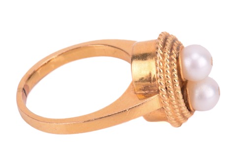 Lot 120 - A pearl-set dress ring, mounted with two round...