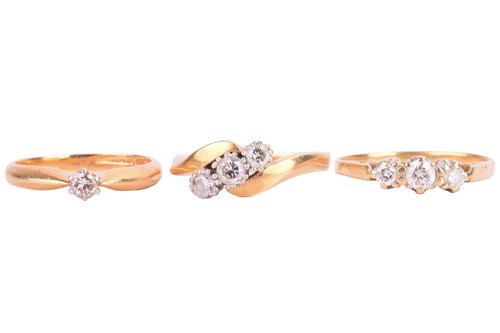 Lot 104 - Three diamond-set rings in 18ct gold; the...