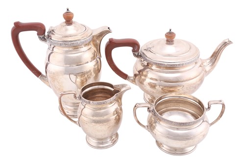 Lot 564 - A silver 1940s four-piece tea and coffee set...