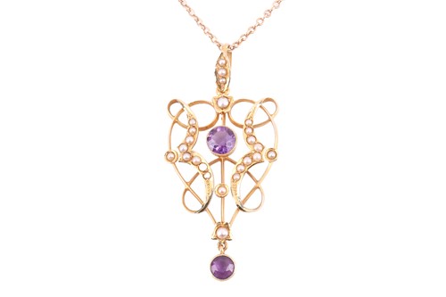 Lot 277 - An Edwardian amethyst and seed pearl pendant...