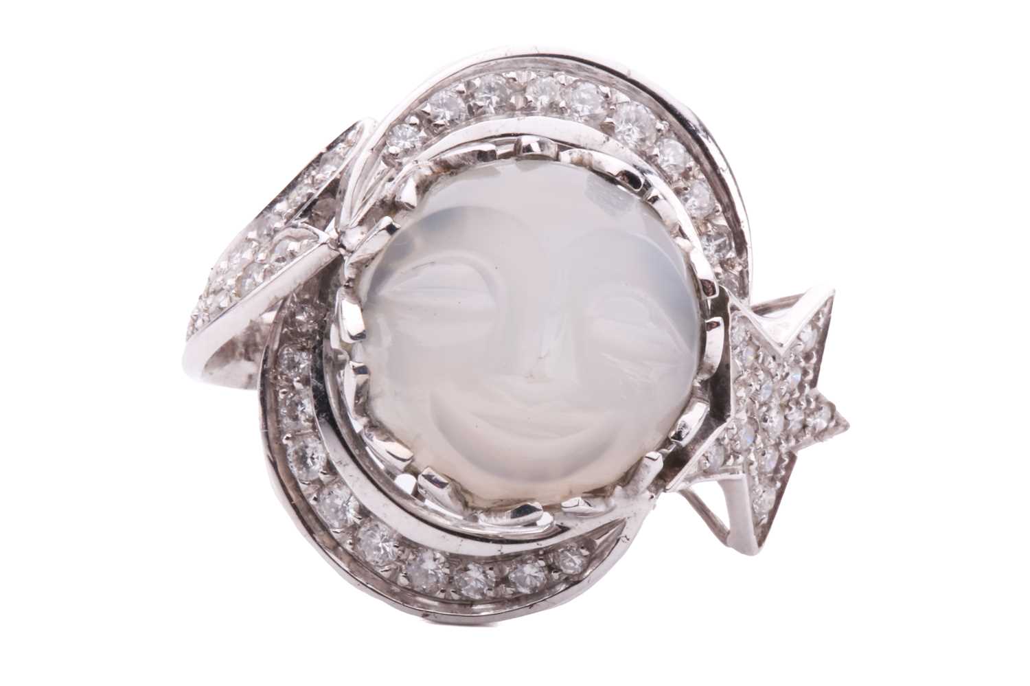 Lot 86 - A carved moonstone and diamond dress ring,...