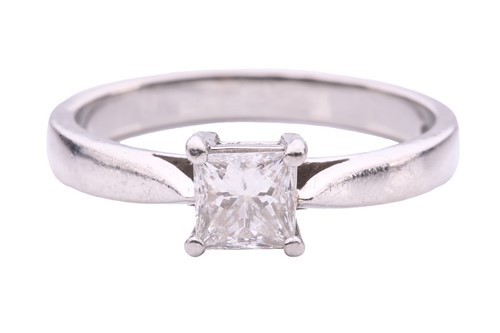 Lot 346 - A princess-cut diamond solitaire ring in...