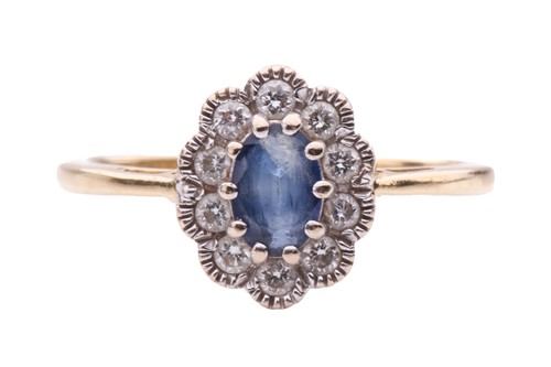 Lot 289 - A sapphire and diamond cluster ring; featuring...