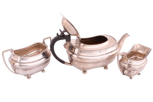Lot 422 - A three piece silver tea set, rounded...