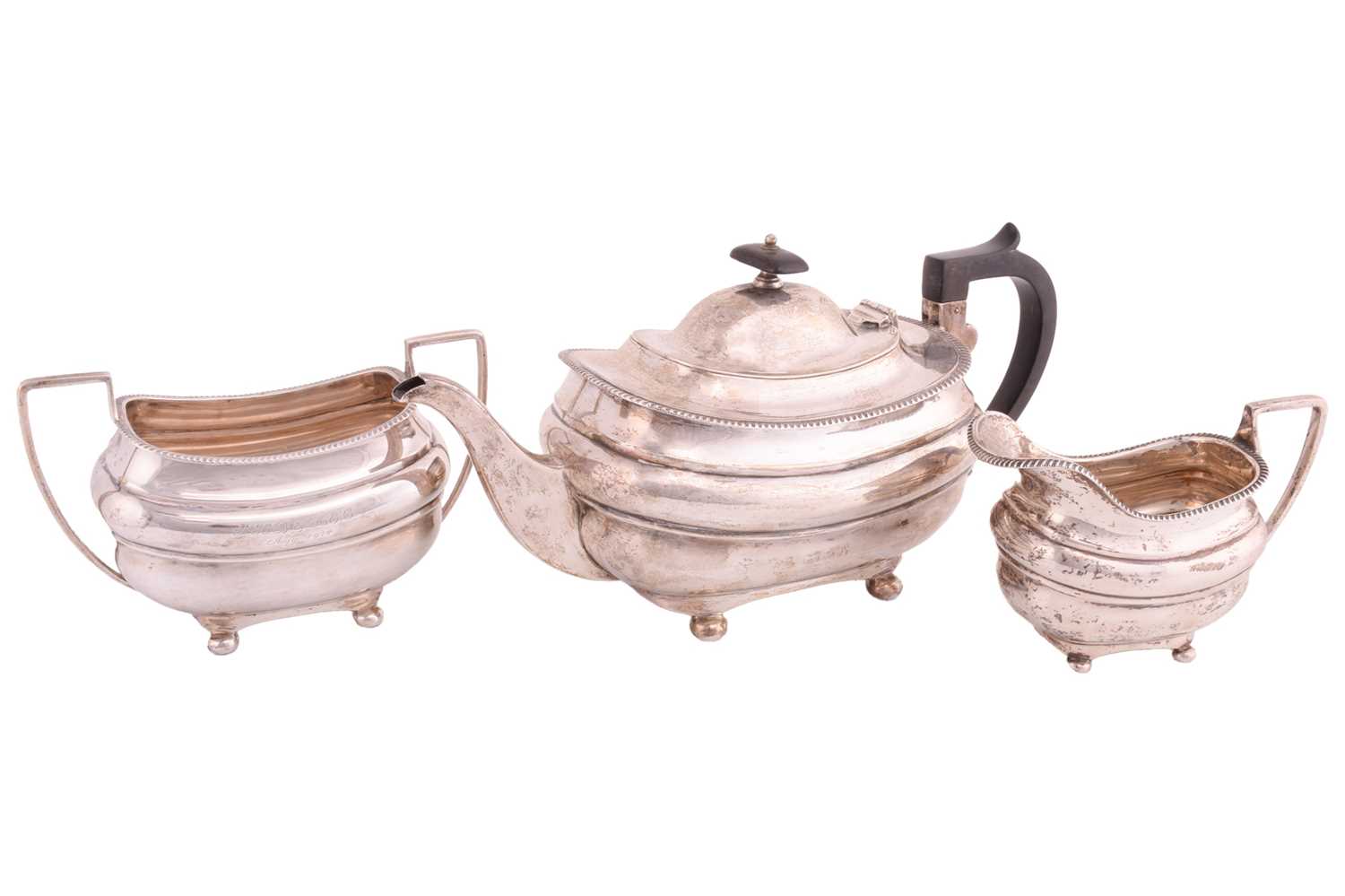 Lot 422 - A three piece silver tea set, rounded...