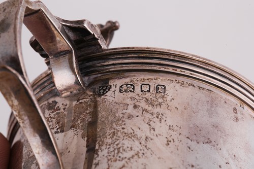 Lot 411 - A George II silver cream jug, inverted...