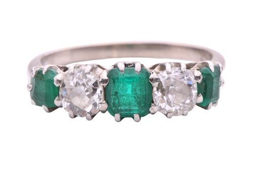 Lot 281 - An emerald and diamond five-stone half hoop...