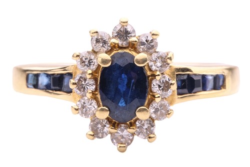 Lot 173 - A sapphire and diamond cluster ring, set with...