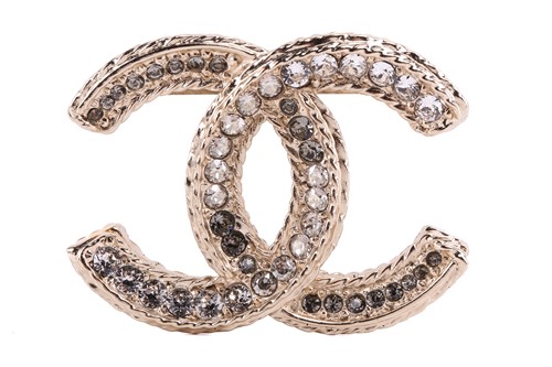 Lot 118 - Chanel - an interlocking CC logo brooch with...
