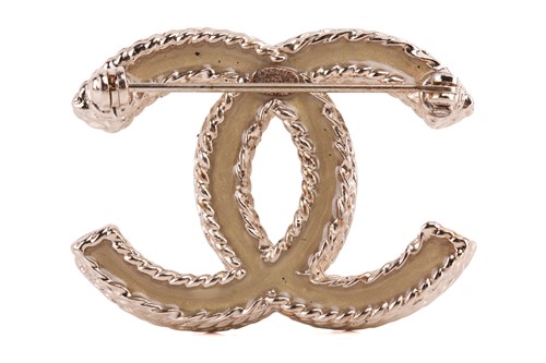 Lot 118 - Chanel - an interlocking CC logo brooch with...