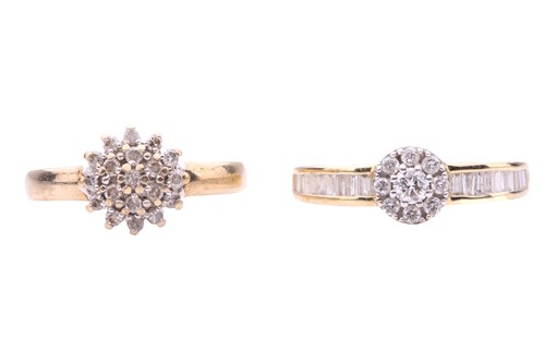 Lot 21 - Two diamond cluster rings; the first in the...