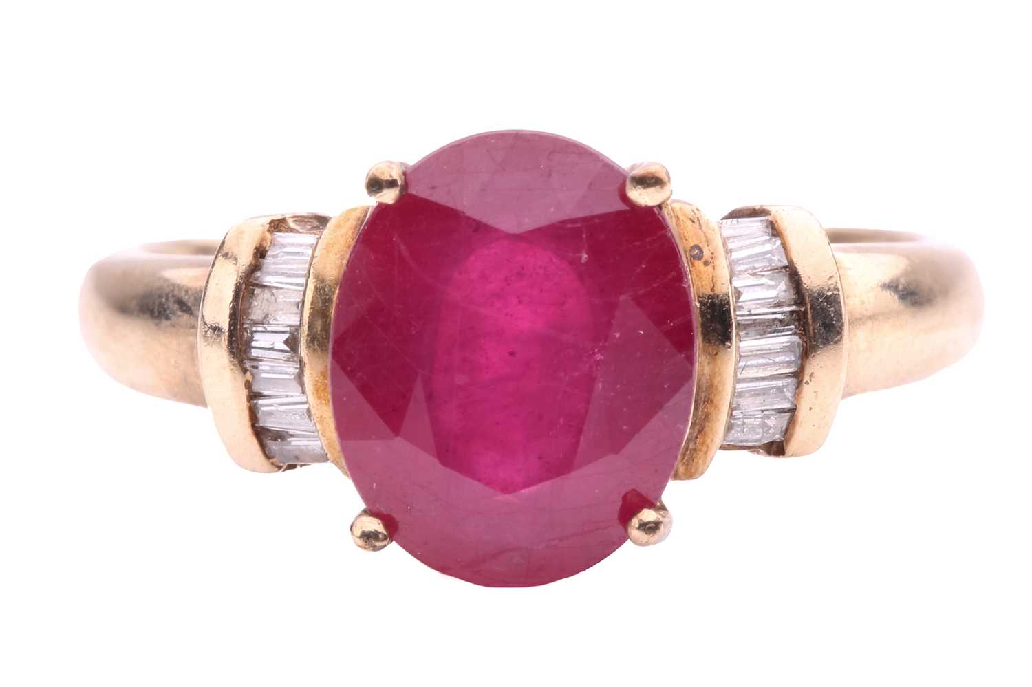 Lot 9 - A glass-filled ruby and diamond ring, the oval...