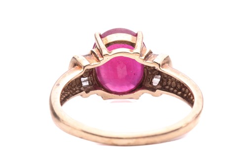 Lot 9 - A glass-filled ruby and diamond ring, the oval...