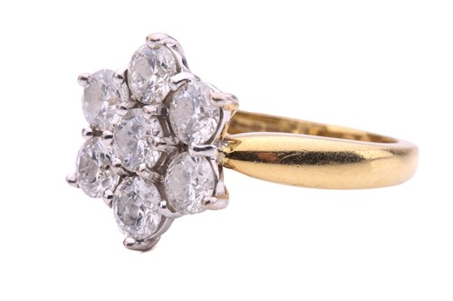 Lot 27 - A diamond cluster ring, set with seven round...