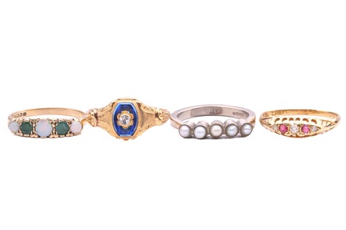 Lot 103 - A collection of four gem-set rings, including...