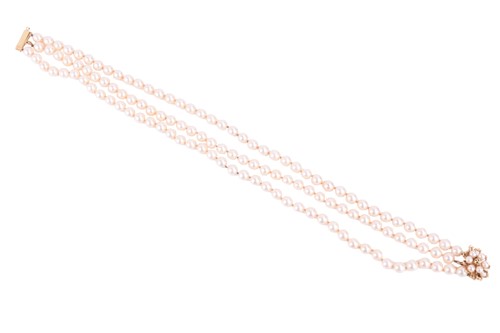 Lot 65 - A three-row cultured pearl necklace with...