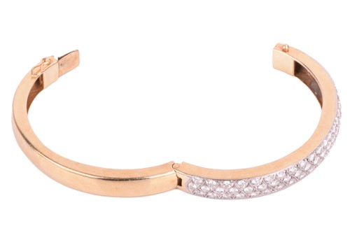 Lot 45 - A diamond-set hinged bracelet, consisting of...